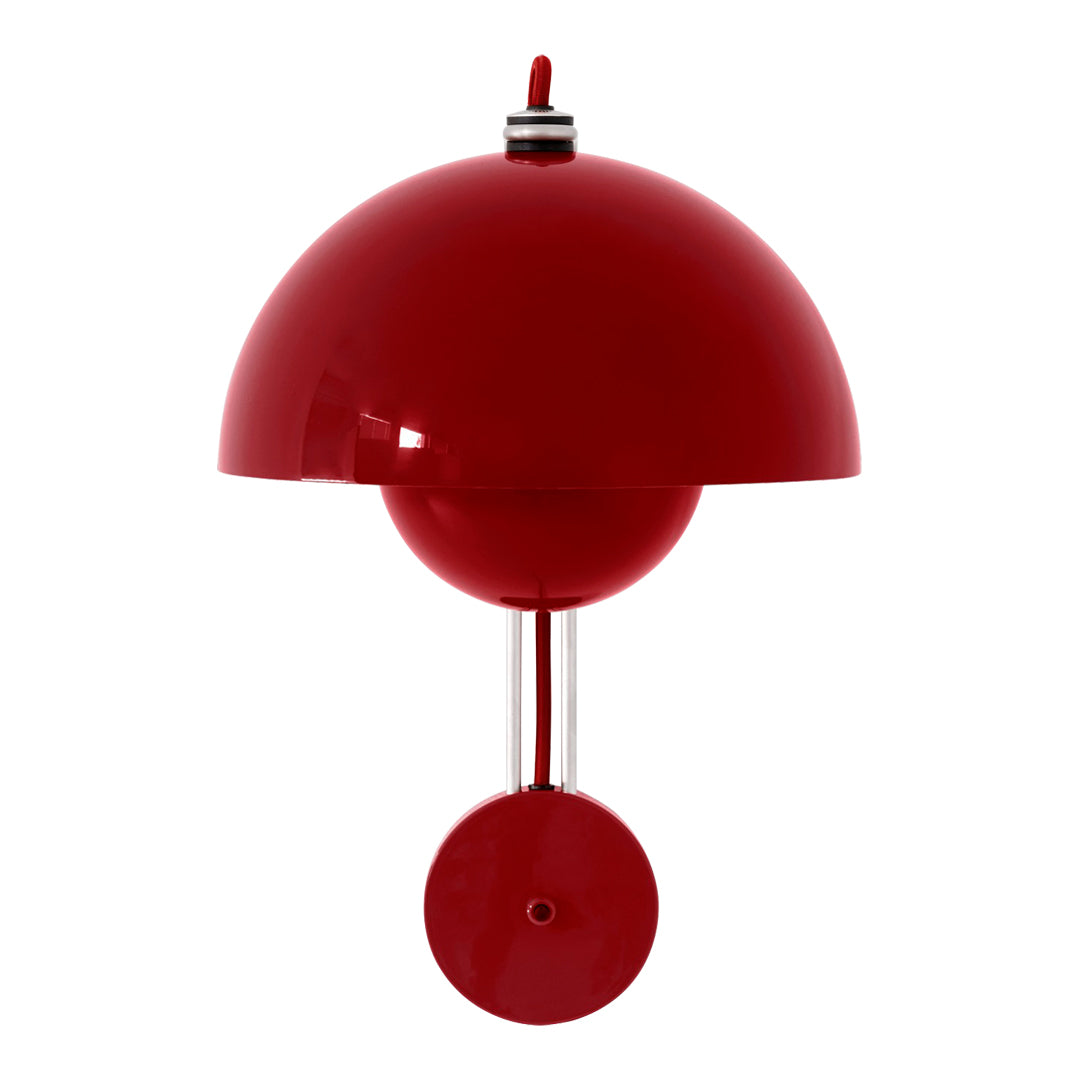 Red dome-shaped lamp with a spherical base and sleek metallic accents, adding a vibrant pop of color to any space.