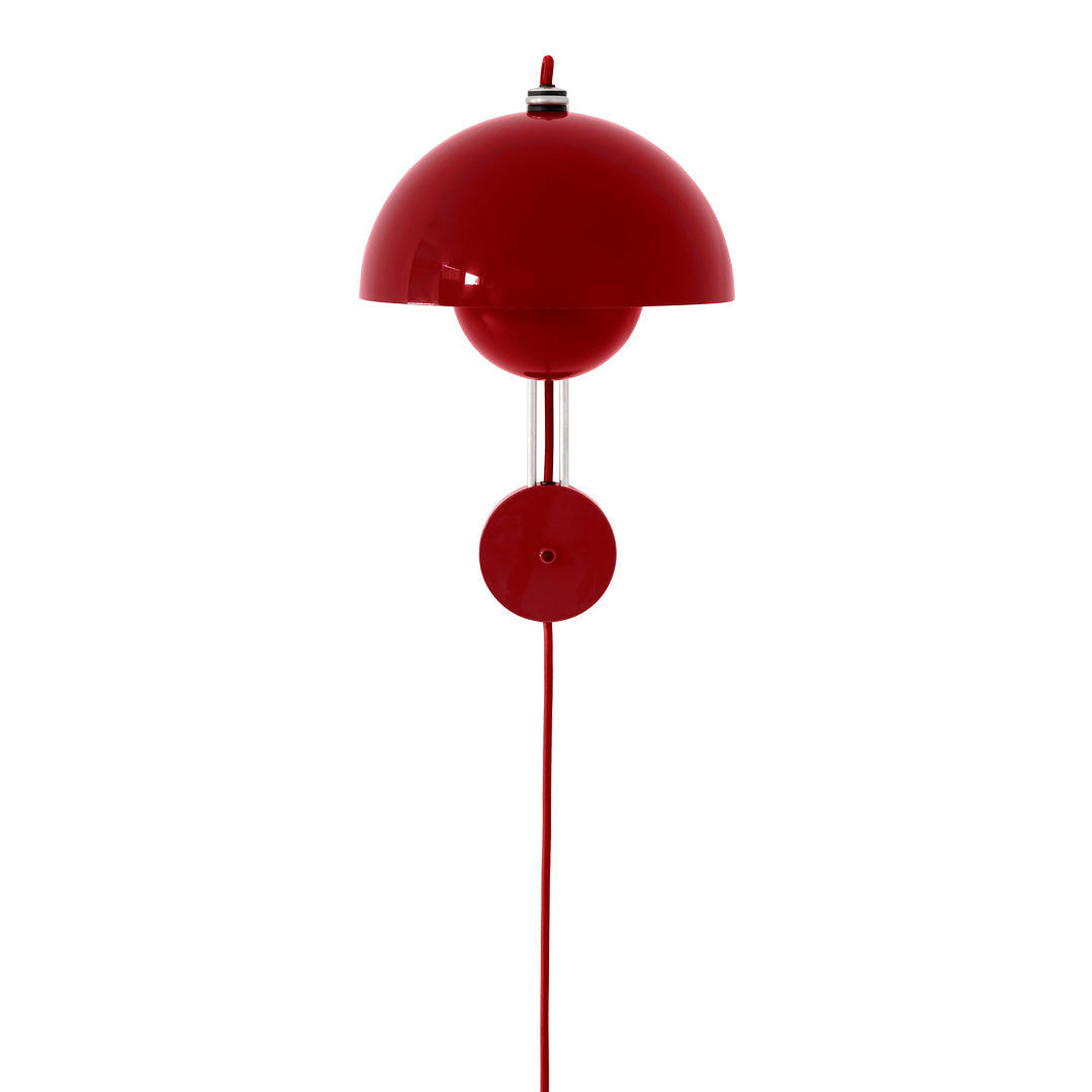 Vibrant red wall lamp with a sleek, modern design and smooth round shape. Perfect for adding a pop of color to any space.