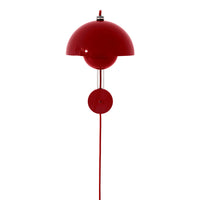 Vibrant red wall lamp with a sleek, modern design and smooth round shape. Perfect for adding a pop of color to any space.