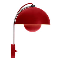 Red dome lamp with a glossy finish, sleek chrome arm, and a round base complementing modern decor.