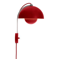 Red wall lamp with a glossy dome shade and chrome accents, featuring a round light globe and a matching red cord.