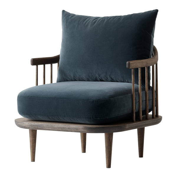 Mid-century modern chair featuring a deep blue velvet cushion and a dark wooden frame with vertical slats.