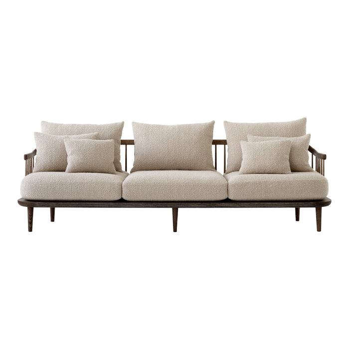 Beige fabric sofa with multiple soft cushions and a sleek wood frame, offering a modern and minimalist design.