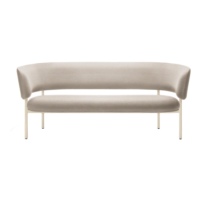 Beige curved sofa with sleek cream legs, featuring a smooth, minimalist design and no visible patterns.