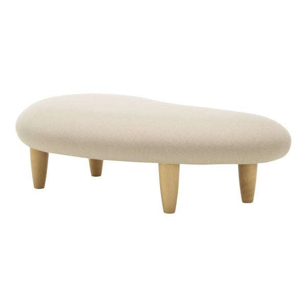 Beige organic-shaped ottoman with natural wooden legs, featuring a soft textured fabric.
