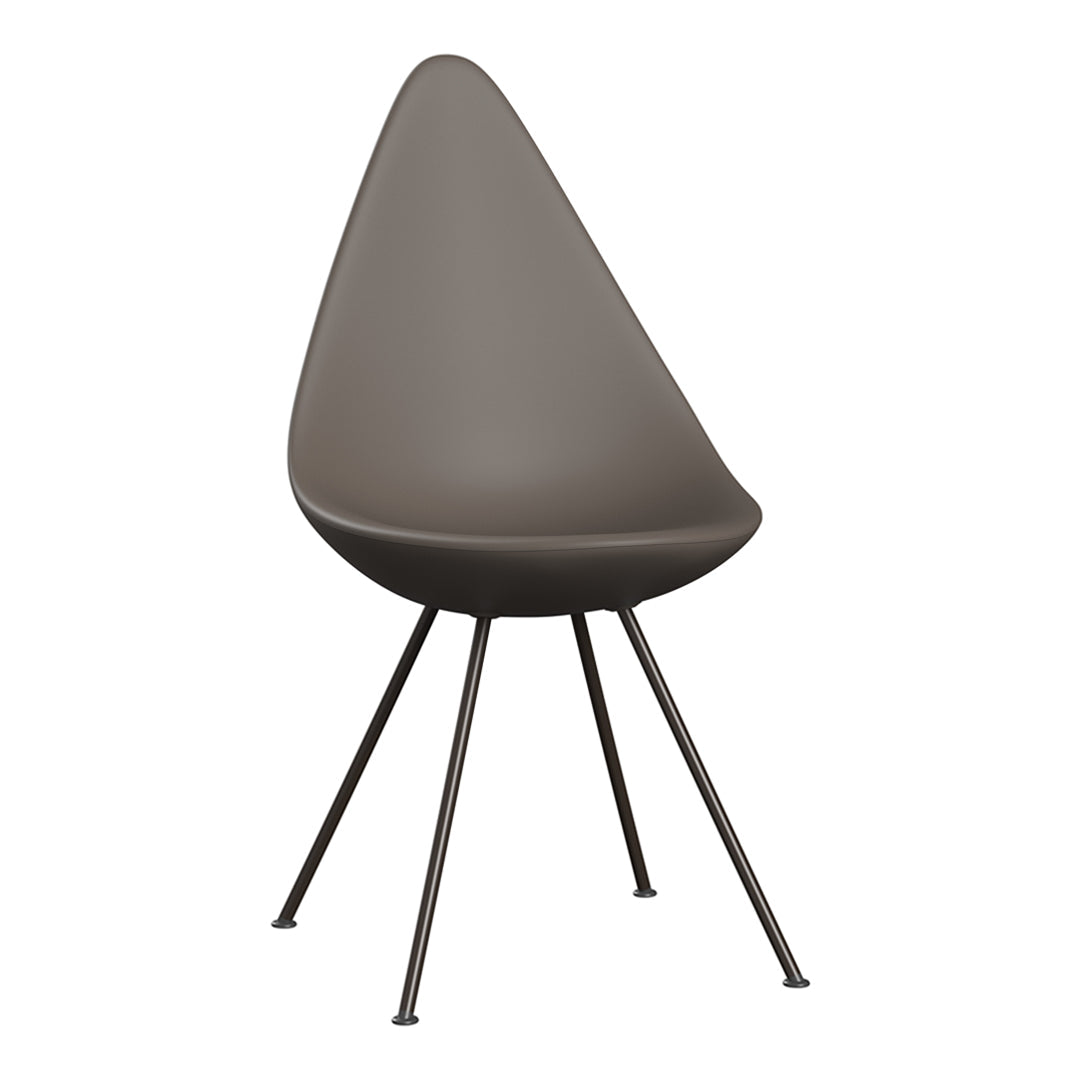 "Smooth taupe chair with an elongated teardrop shape and sleek metal legs, showcasing modern minimalism."