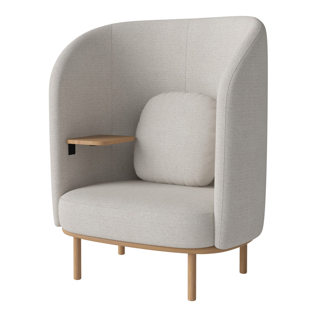 Light gray upholstered chair with a smooth, minimalist design and wooden accents, featuring a cozy side table.