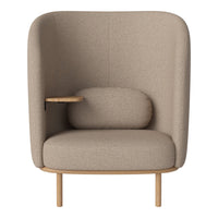 Beige upholstered armchair with smooth texture and wooden accents, featuring a minimalist design and cozy rounded cushions.