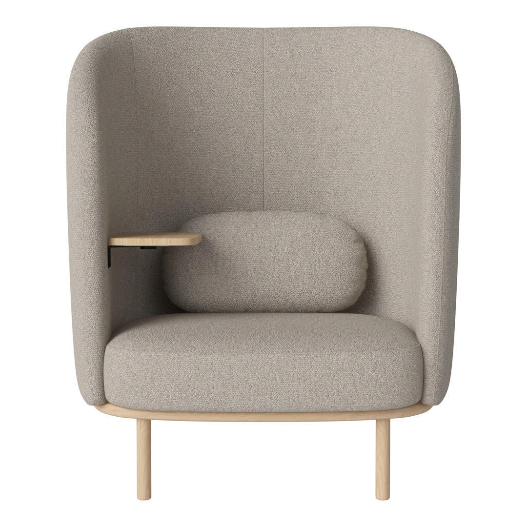 Gray upholstered armchair with a minimalist design, featuring a wood armrest and rounded cushion. Soft, neutral tones.