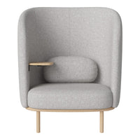 Gray upholstered armchair with a minimalist design and soft curves, featuring a wooden armrest and base.