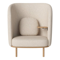 Beige high-back armchair with a textured fabric, featuring a matching cushion and a light wood accent table.
