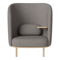 Grey upholstered armchair with a minimalist design, featuring a wooden accent and soft, smooth textures.