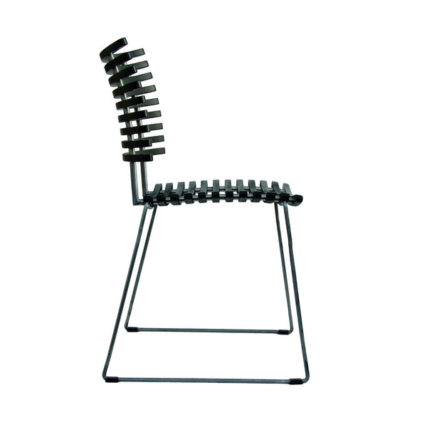 Modern black chair with a unique slatted back design and minimalist wire frame, adding contemporary style to any space.