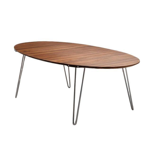 Oval wooden table with a rich brown finish and sleek metal legs, featuring a smooth, minimalist design.