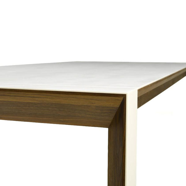 White tabletop with a sleek matte finish and rich brown wooden edges in a contemporary design.
