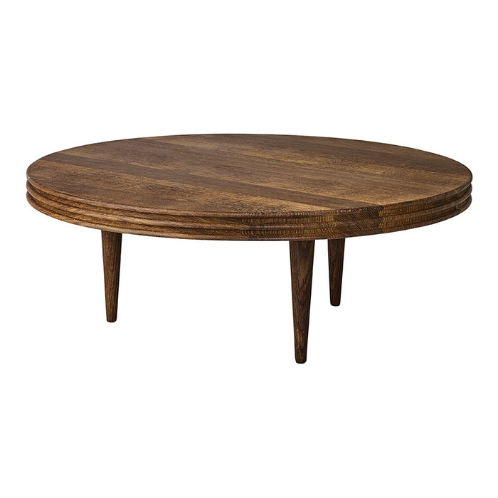 Round coffee table in rich brown wood with a smooth finish and subtle textural patterns. Mid-century modern design.