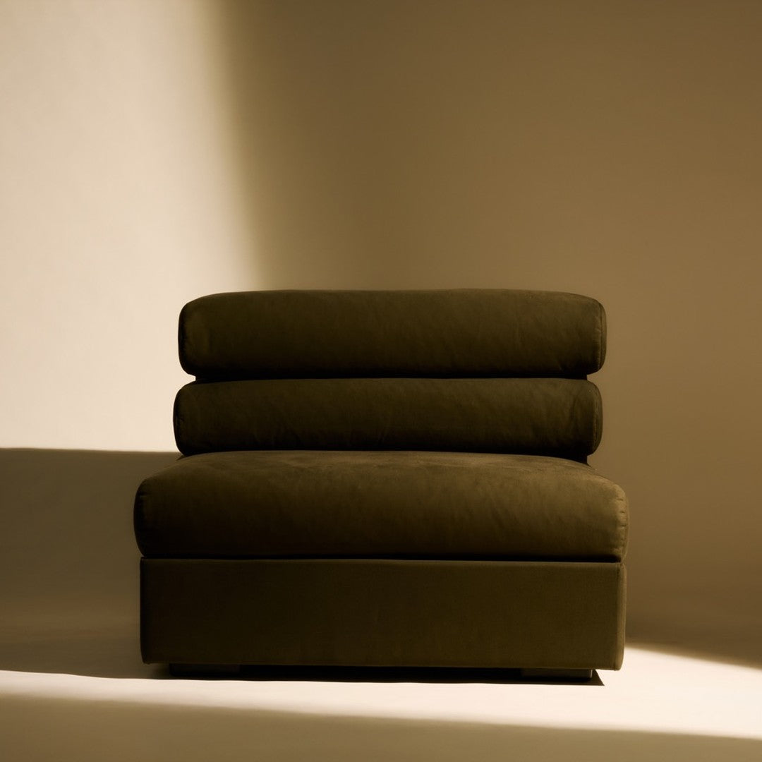Dark olive green upholstered chair with plush cushions, featuring a modern, minimalist design. Soft texture and rich hue.