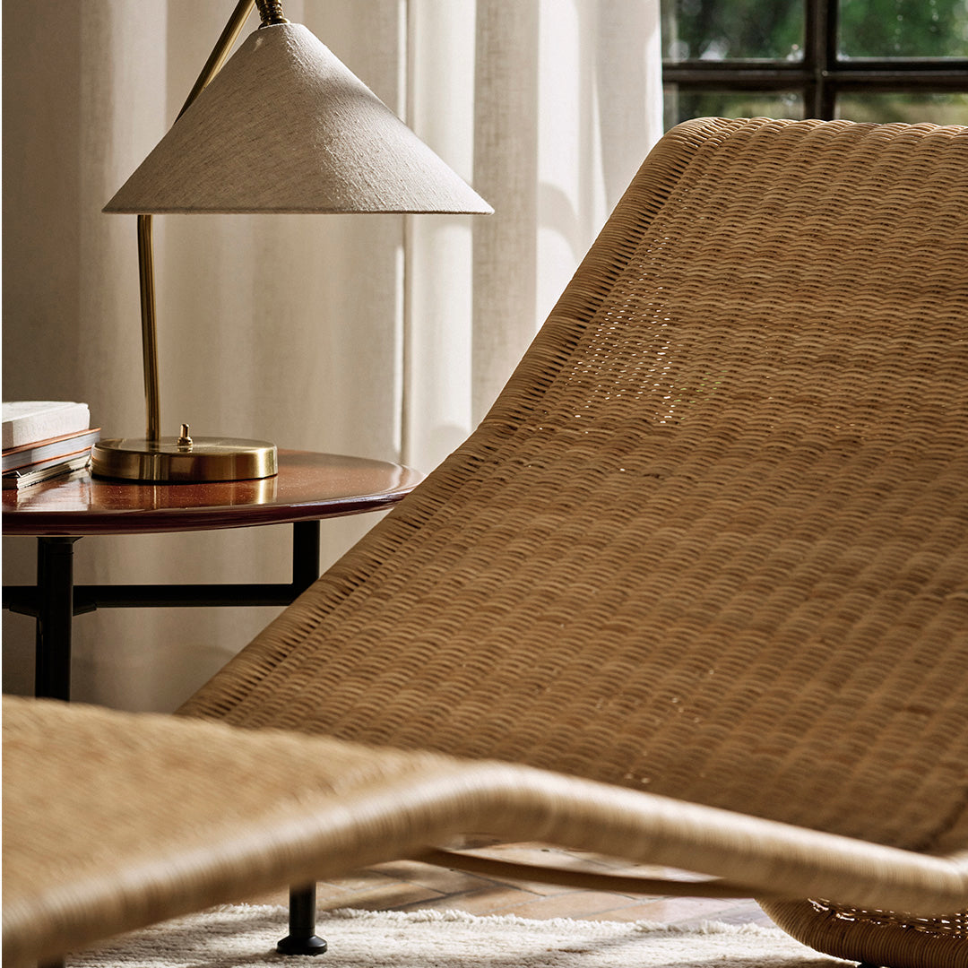 Natural woven texture in soft beige with subtle patterns, complemented by warm wood tones and soft light.