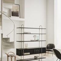 Modern black metal shelving unit with sleek lines and glass accents, set against a neutral, minimalist background.