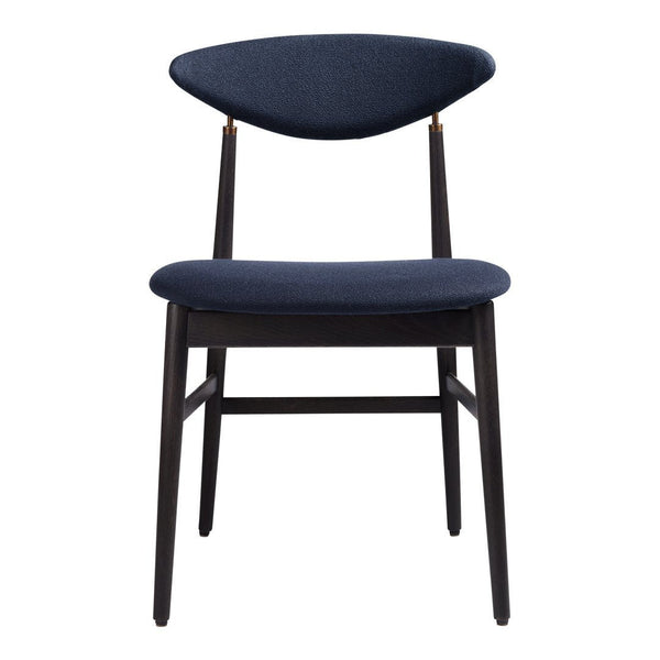 Navy blue upholstered dining chair with a sleek design and contrasting dark wood legs. Modern minimalist pattern.