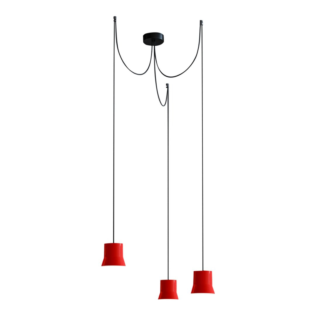 Red pendant lights with sleek black wiring, modern design, and minimalistic patterns for contemporary decor.