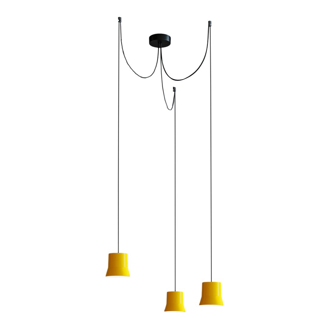 "Modern pendant light with three yellow shades and sleek black ceiling mount, showcasing a minimalist design."