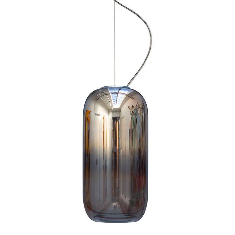 Glossy amber pendant light with a sleek, elongated shape and iridescent surface reflecting subtle hues.