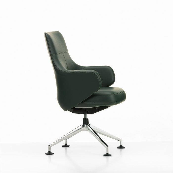Green leather office chair with a sleek design and chrome base, showcasing a modern and minimalistic style.