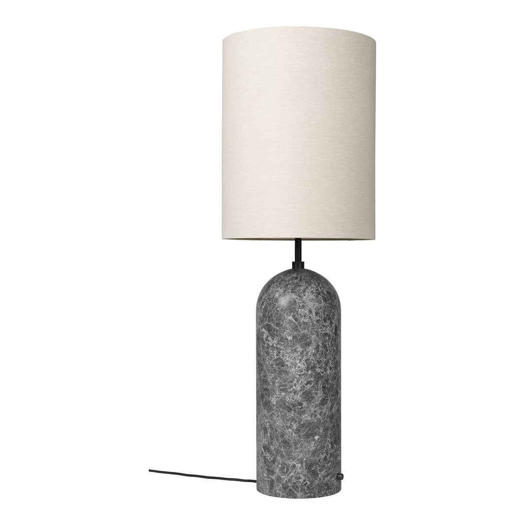 Table lamp with a gray textured base and white lampshade on a white background