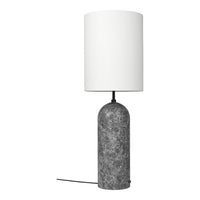 Table lamp with a gray textured base and white shade on a white background