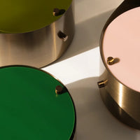 Green, pink, and gold circular decorative boxes with smooth finishes and stylish accents. Perfect for modern decor.