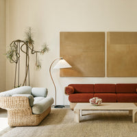 Light blue and terracotta sofa set with textured woven detailing in a neutral-toned living room.