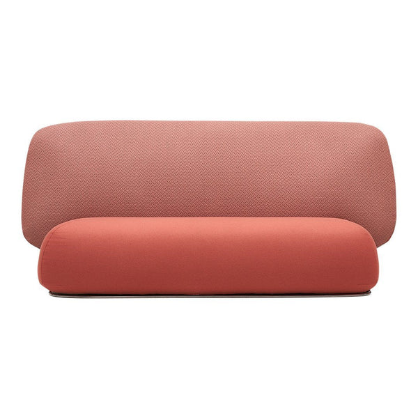 "Two-tone sofa in soft pink and coral colors with a smooth, modern design."
