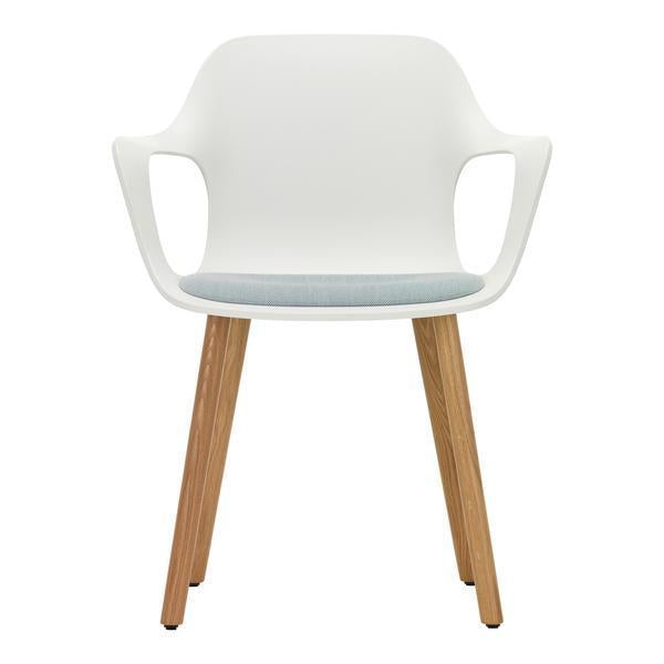 White modern chair with light blue cushion and natural wood legs, sleek design perfect for contemporary spaces.