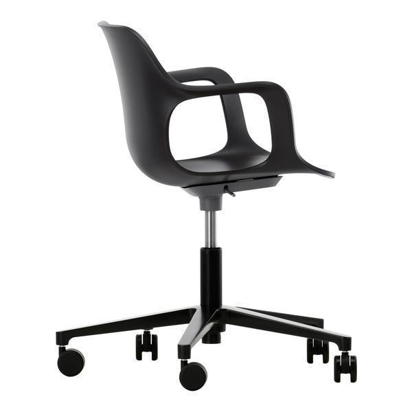 Black ergonomic swivel chair with sleek design and smooth, modern lines on a sturdy wheeled base.