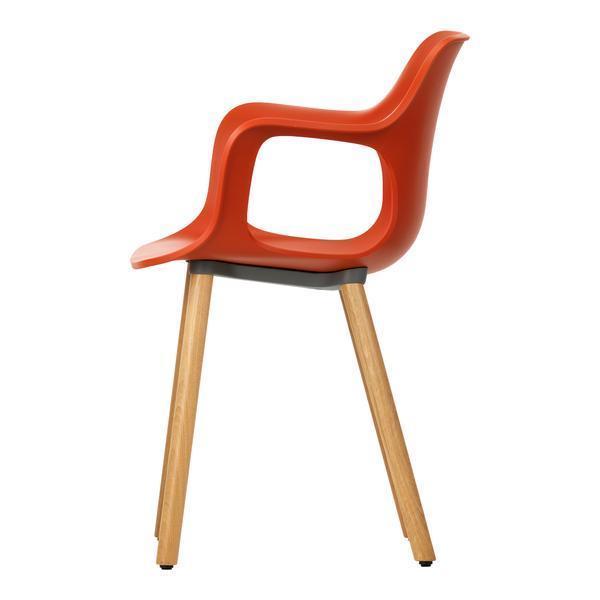 Modern orange chair with a sleek design and wooden legs, perfect for adding a pop of color to any space.