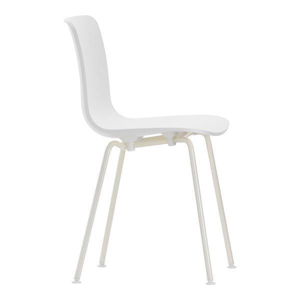 White minimalist chair with smooth, curved surfaces and sleek, light-colored legs. Simple and modern design.
