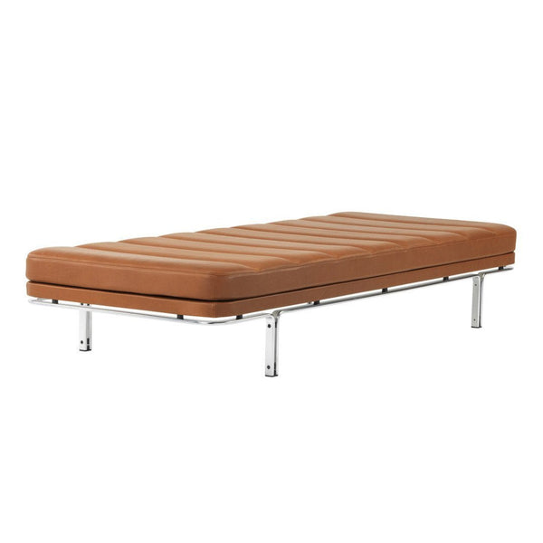 Brown upholstered mattress with a ribbed pattern on a sleek metallic frame. Ideal for modern interior decor.