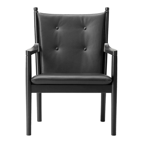 Black leather chair with a button-tufted design and sleek black wooden frame. Perfect for modern decor.