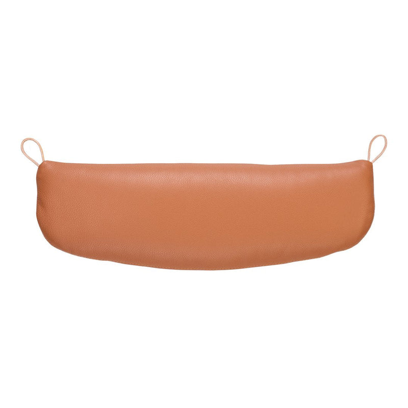 Tan leather cushion with a smooth texture and curved design, featuring attached loops for easy hanging.