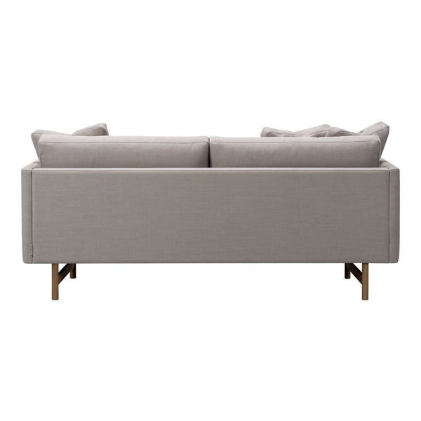 Gray upholstered sofa with subtle texture and two plush back cushions, featuring sleek metal legs.