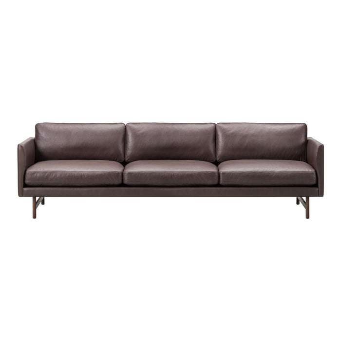 Brown leather sofa with sleek, minimalist design and subtle stitching details. Modern and stylish for any living space.