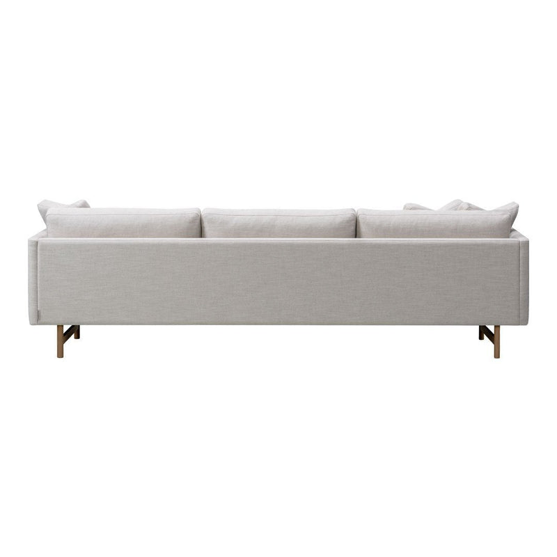 Light gray modern sofa with clean lines and subtle textured fabric, featuring minimalist design and wooden legs.