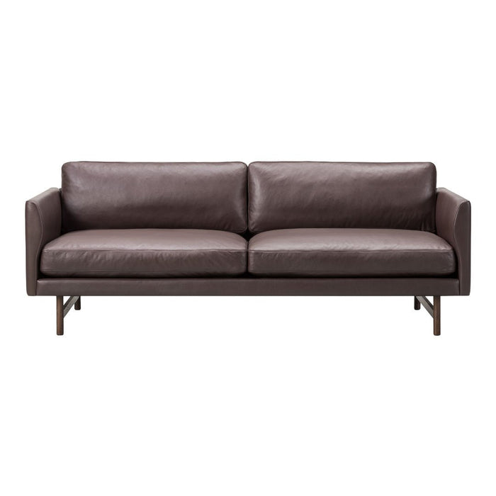 Brown leather sofa with a sleek, modern design and minimalistic pattern, perfect for contemporary living spaces.