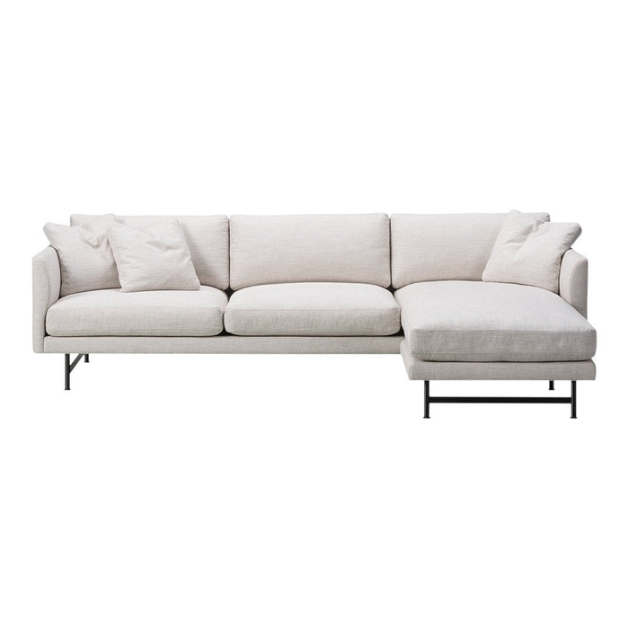 Light grey sectional sofa with plush cushions and clean lines, featuring a sleek black metal frame.