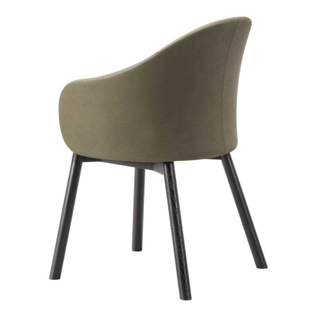 Olive green upholstered chair with sleek black wooden legs, showcasing a modern and minimalist design.