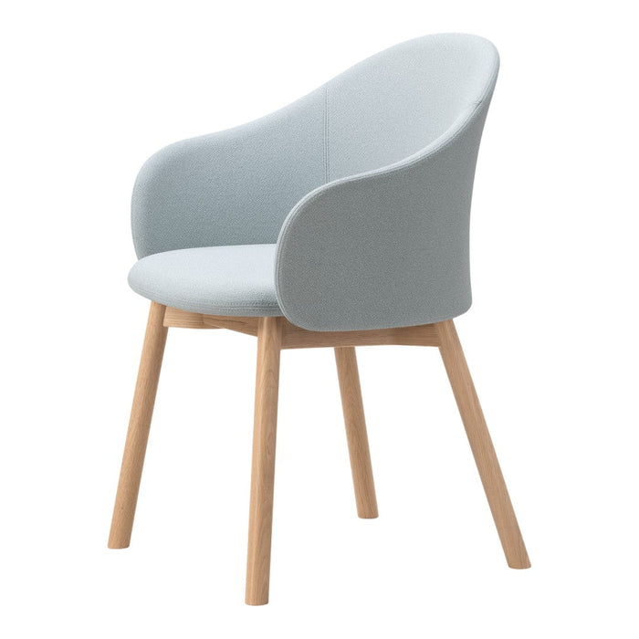 Light blue upholstered chair with textured fabric and natural wood legs, offering a modern and calming aesthetic.