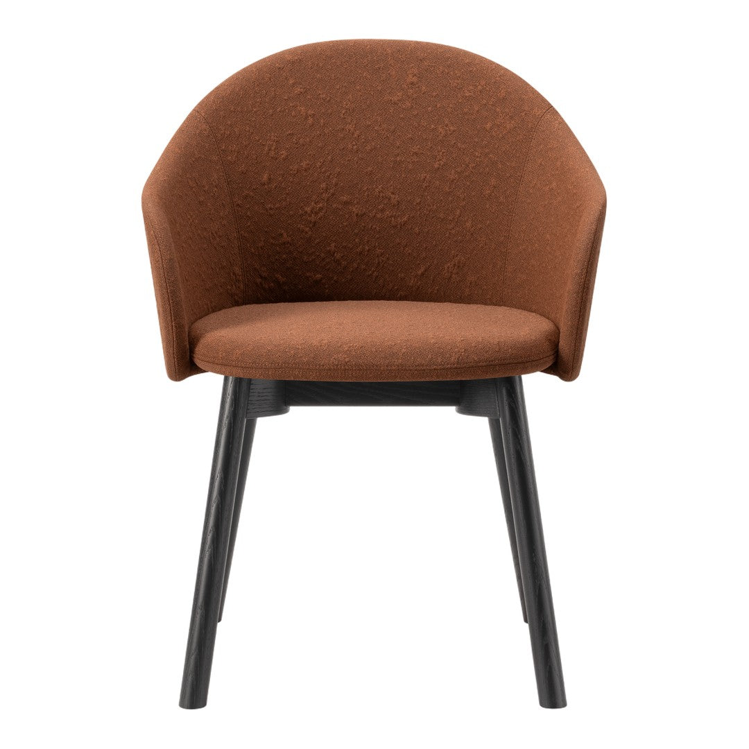 Rust-colored fabric chair with a textured finish and sleek black wooden legs. Modern and stylish design.