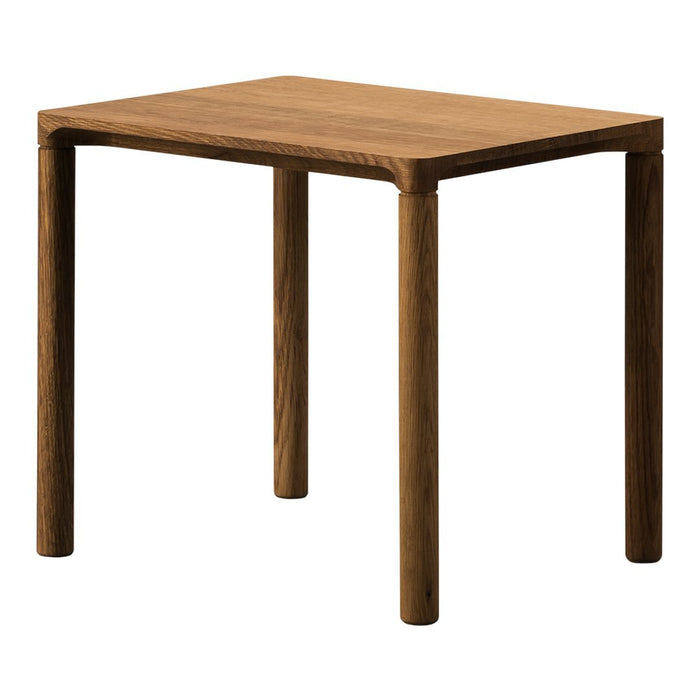 Solid wood table in a rich walnut finish with a smooth, straight-edged design and minimalistic legs.