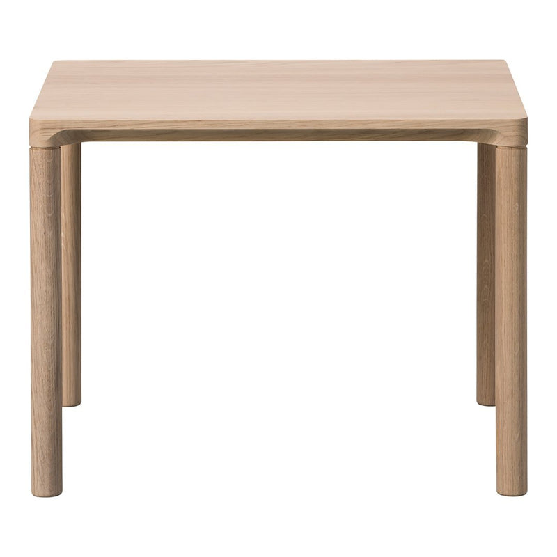 Light wood square table with a smooth finish and rounded corners. Neutral beige tones complement any decor.